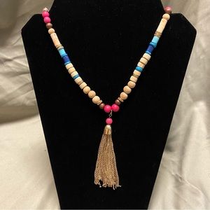 Wood and plastic beads with gold tassel necklace